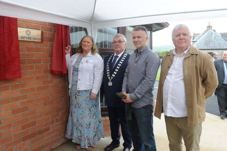 Ann Marie McNally, Cllr. Gerry Crawford, Pierce McIntyre and Aidan McIntyre unveiling the plaque